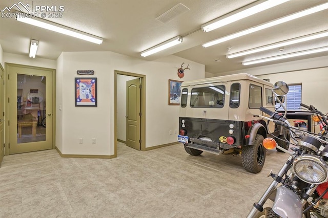 exercise area featuring carpet flooring, baseboards, and visible vents