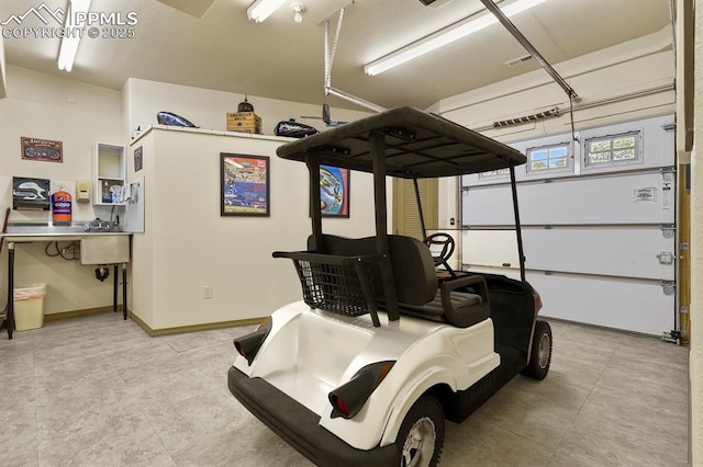 garage featuring baseboards