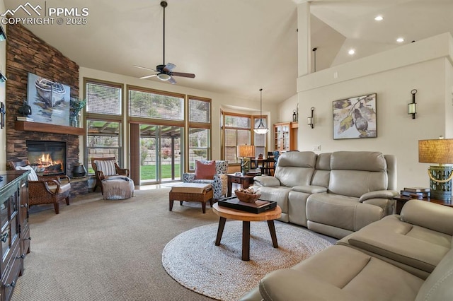 carpeted living room featuring recessed lighting, a ceiling fan, high vaulted ceiling, and a fireplace