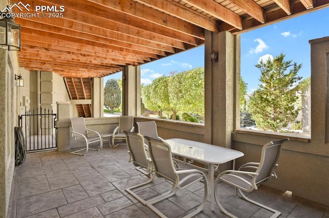 sunroom with plenty of natural light and outdoor dining space
