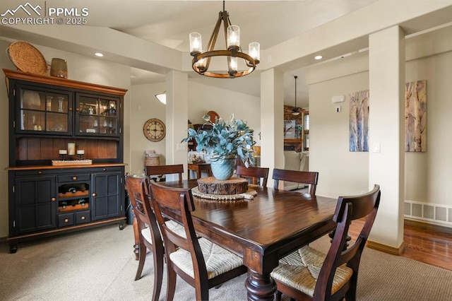dining room featuring light colored carpet, an inviting chandelier, recessed lighting, baseboards, and visible vents