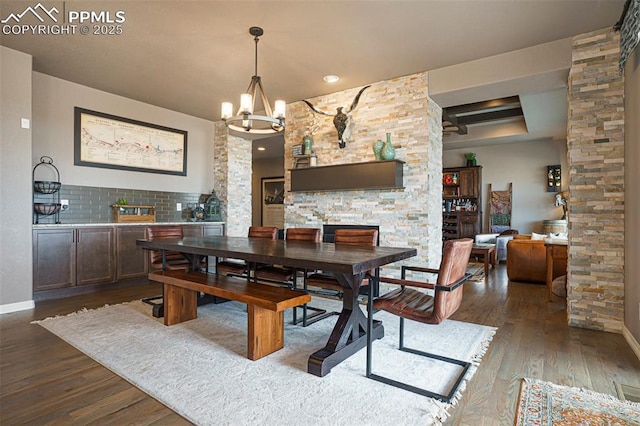 12857 Morning Breeze Way, Peyton, CO 80831 - dining space featuring baseboards, an inviting chandelier, and wood finished floors