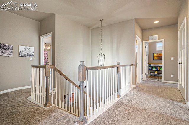 12857 Morning Breeze Way, Peyton, CO 80831 - hall with visible vents, baseboards, an upstairs landing, carpet flooring, and recessed lighting
