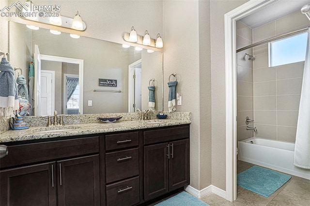 12857 Morning Breeze Way, Peyton, CO 80831 - full bath featuring double vanity, tile patterned floors, tub / shower combination, and a sink