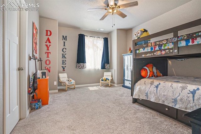 12857 Morning Breeze Way, Peyton, CO 80831 - bedroom with baseboards, ceiling fan, carpet, and a textured ceiling