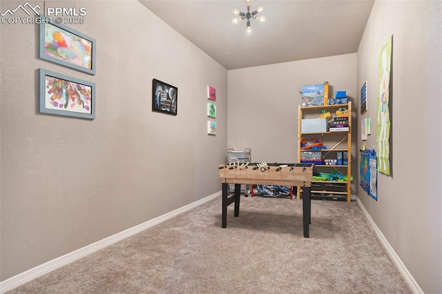 12857 Morning Breeze Way, Peyton, CO 80831 - rec room featuring baseboards, a notable chandelier, and carpet
