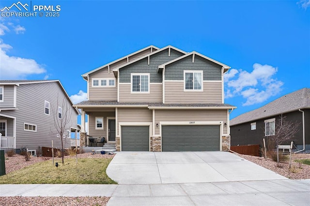 12857 Morning Breeze Way, Peyton, CO 80831 - craftsman-style home featuring concrete driveway, stone siding, and a garage