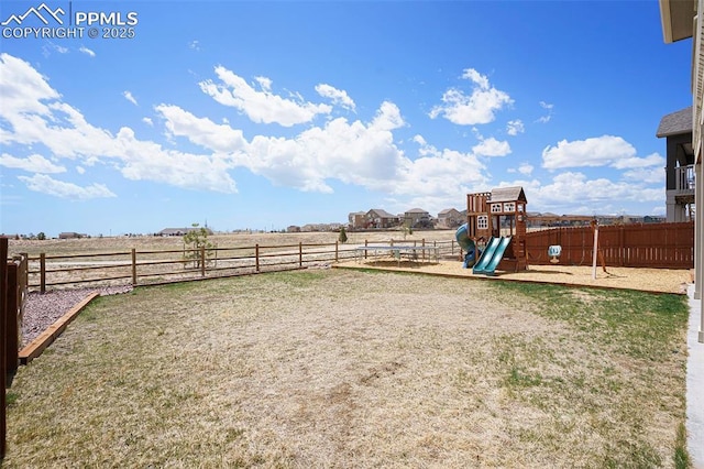 12857 Morning Breeze Way, Peyton, CO 80831 - view of yard featuring a playground and fence