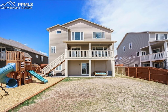 12857 Morning Breeze Way, Peyton, CO 80831 - rear view of house with fence and a playground