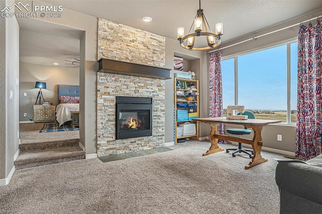 12857 Morning Breeze Way, Peyton, CO 80831 - carpeted office space featuring a stone fireplace, a textured ceiling, baseboards, and ceiling fan with notable chandelier