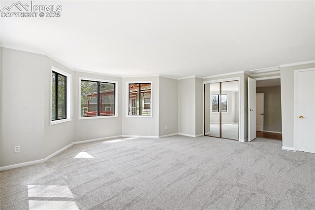 735 N Walnut St, Colorado Springs, CO 80905 - carpeted spare room with crown molding, baseboards, and a healthy amount of sunlight