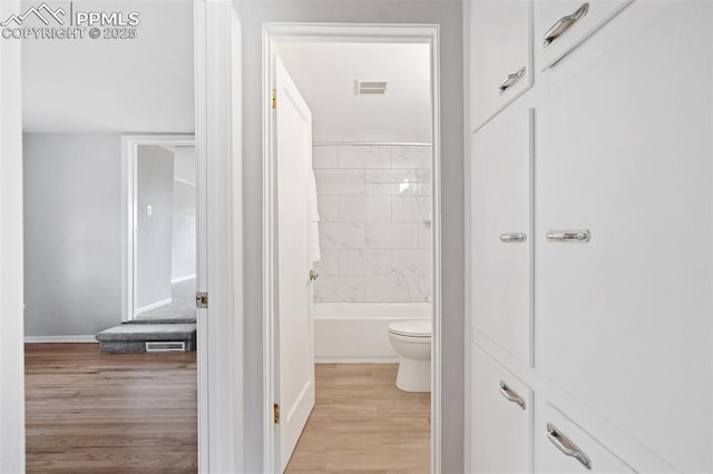 735 N Walnut St, Colorado Springs, CO 80905 - full bath with baseboards, toilet, wood finished floors, and visible vents