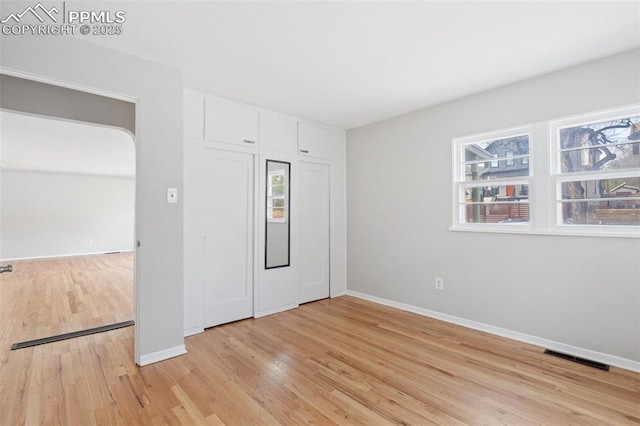 735 N Walnut St, Colorado Springs, CO 80905 - unfurnished bedroom featuring baseboards, a closet, light wood finished floors, and visible vents