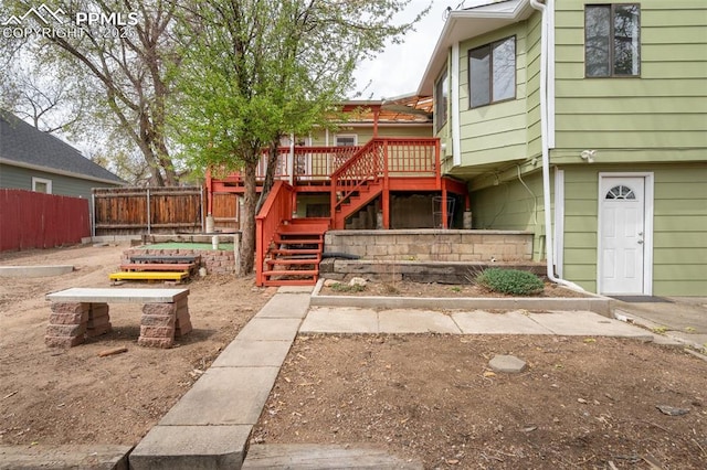 735 N Walnut St, Colorado Springs, CO 80905 - exterior space with fence, a vegetable garden, stairway, and a deck