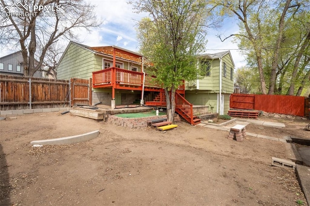 735 N Walnut St, Colorado Springs, CO 80905 - view of jungle gym featuring stairs, a fenced backyard, and a wooden deck
