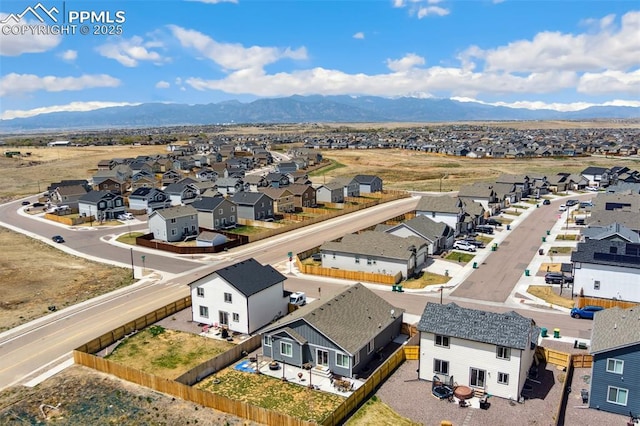 birds eye view of property featuring a mountain view and a residential view
