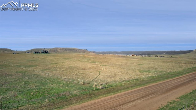 view of mountain feature with a rural view