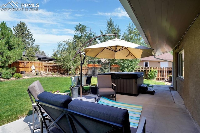 view of patio featuring a fenced backyard and a hot tub