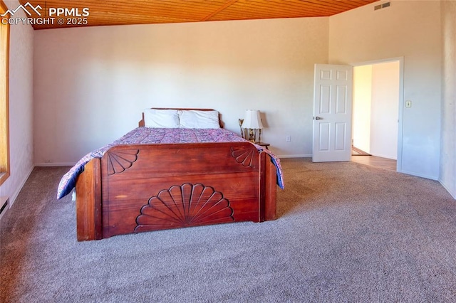 bedroom featuring wooden ceiling, carpet floors, visible vents, and baseboards