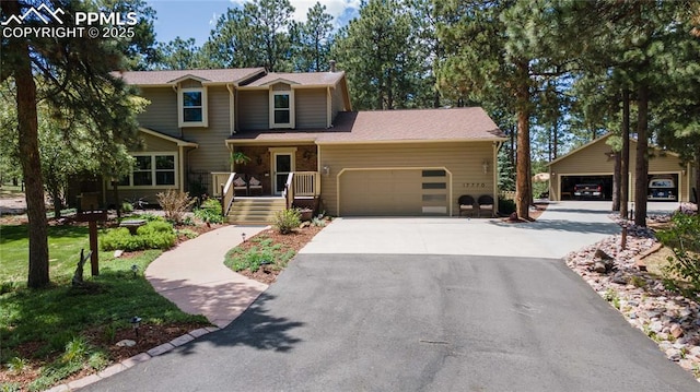 17770 Radbourne Ct, Monument, CO 80132 - view of front facade with a garage and asphalt driveway