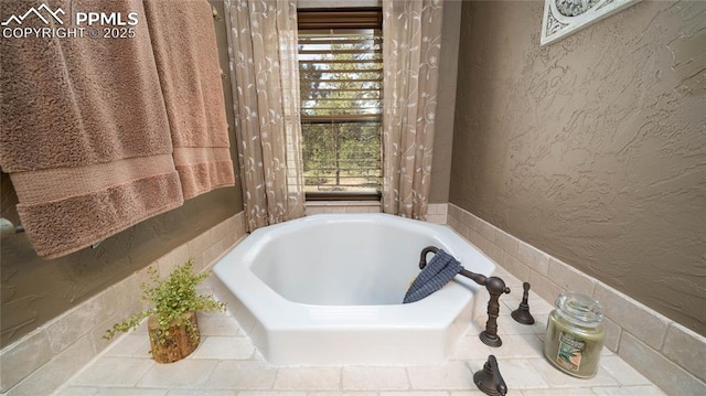 17770 Radbourne Ct, Monument, CO 80132 - bathroom with a bath, healthy amount of natural light, and a textured wall