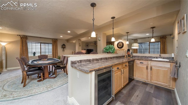 17770 Radbourne Ct, Monument, CO 80132 - kitchen featuring wine cooler, light brown cabinets, a sink, baseboards, and dishwasher