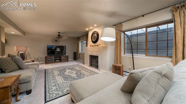 17770 Radbourne Ct, Monument, CO 80132 - carpeted living room featuring recessed lighting, a ceiling fan, a tile fireplace, a baseboard radiator, and baseboards