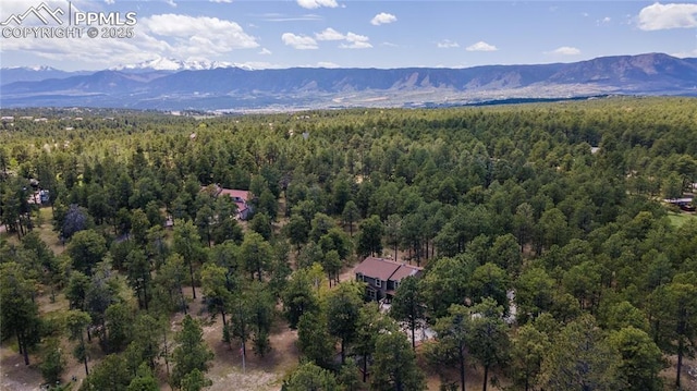17770 Radbourne Ct, Monument, CO 80132 - aerial view of a heavily wooded area and a mountain backdrop