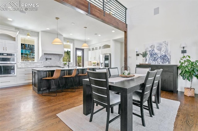 13625 Kitty Joe Ct, Colorado Springs, CO 80921 - dining space with recessed lighting, dark wood finished floors, and a high ceiling
