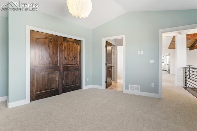 13625 Kitty Joe Ct, Colorado Springs, CO 80921 - unfurnished bedroom featuring vaulted ceiling, carpet floors, visible vents, and baseboards