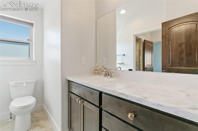 13625 Kitty Joe Ct, Colorado Springs, CO 80921 - bathroom with baseboards, vanity, and toilet