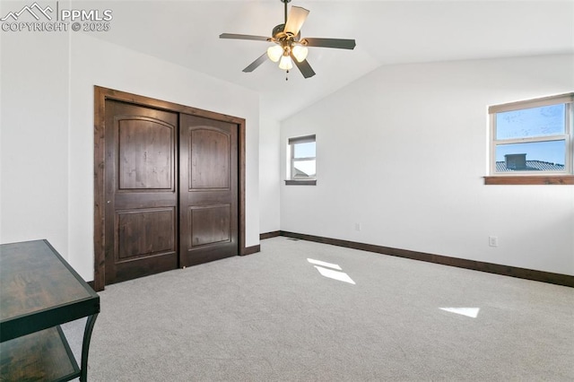 13625 Kitty Joe Ct, Colorado Springs, CO 80921 - unfurnished bedroom featuring lofted ceiling, baseboards, carpet flooring, and ceiling fan