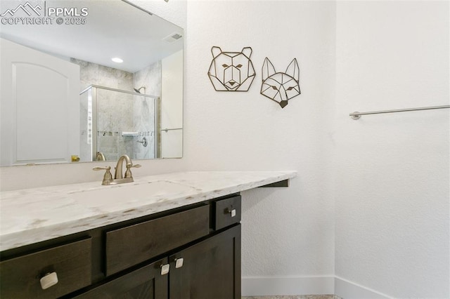 13625 Kitty Joe Ct, Colorado Springs, CO 80921 - full bath with a shower stall, baseboards, vanity, and visible vents