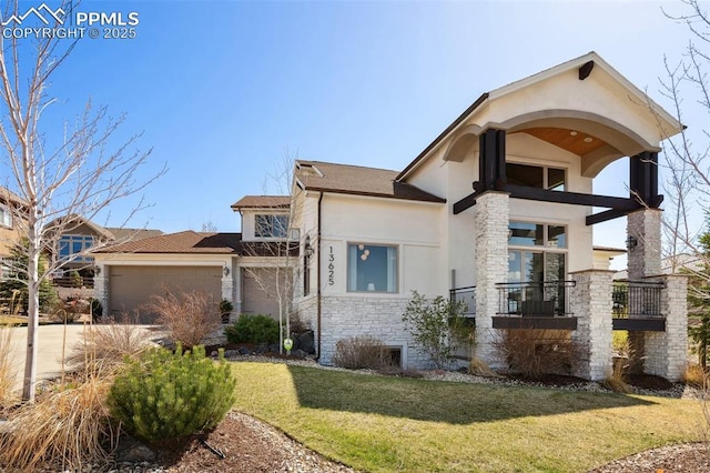 13625 Kitty Joe Ct, Colorado Springs, CO 80921 - view of front of property with a front lawn, driveway, stone siding, an attached garage, and stucco siding