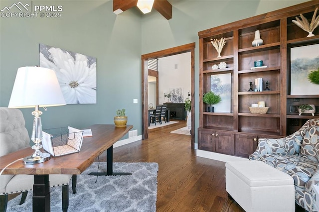 13625 Kitty Joe Ct, Colorado Springs, CO 80921 - home office featuring wood finished floors, a towering ceiling, and baseboards