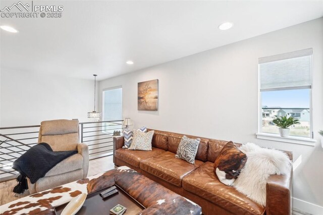 living room with recessed lighting and baseboards