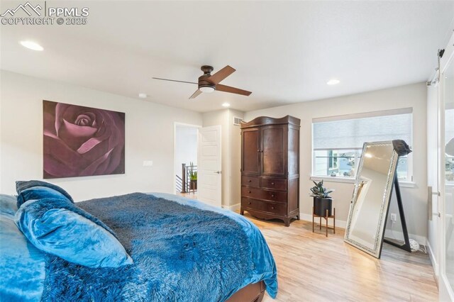 bedroom featuring recessed lighting, light wood-style flooring, ceiling fan, and baseboards