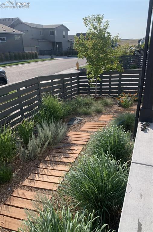 view of yard with fence and a residential view