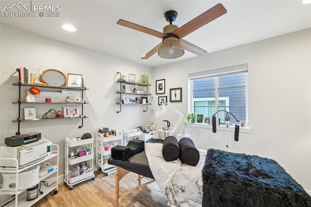 office area with baseboards, ceiling fan, recessed lighting, and wood finished floors