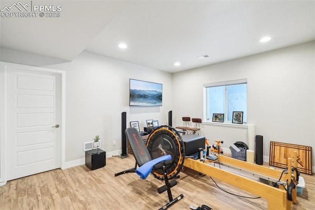 office area with recessed lighting, visible vents, and wood finished floors