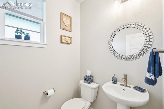 bathroom with a sink and toilet