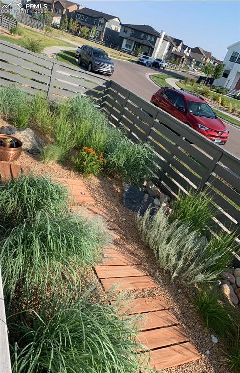 view of yard with fence and a residential view