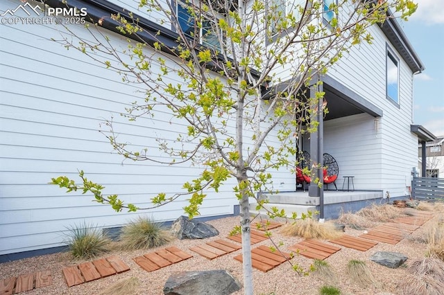 view of property exterior featuring covered porch