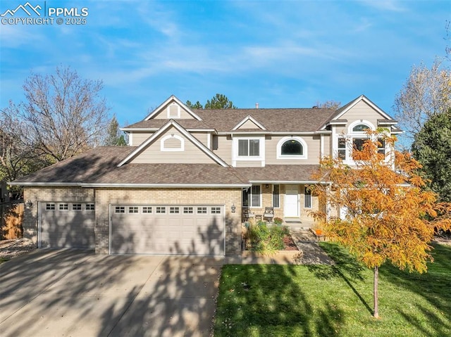 7118 S Parfet St, Littleton, CO 80127 - view of front of house with an attached garage, a shingled roof, a front lawn, and concrete driveway