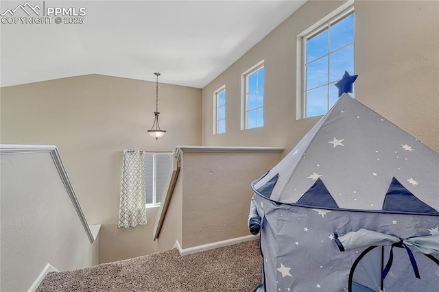 staircase featuring baseboards, carpet, and high vaulted ceiling