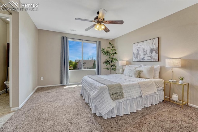 bedroom with a ceiling fan, baseboards, visible vents, and carpet
