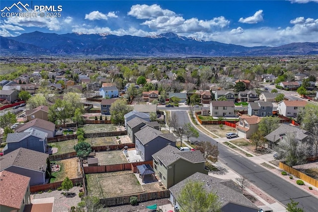 drone / aerial view featuring a residential view and a mountain view