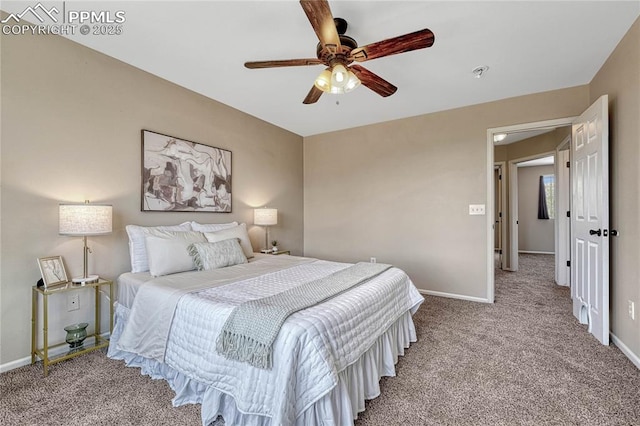 bedroom featuring carpet floors, baseboards, and ceiling fan