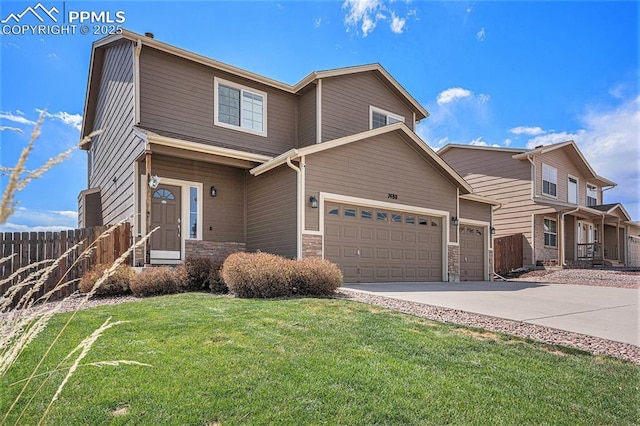 7480 Twin Valley Ter, Colorado Springs, CO 80925 - view of front of house featuring concrete driveway, stone siding, a front yard, an attached garage, and fence
