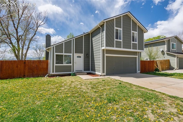 537 Blossom Field Rd, Fountain, CO 80817 - view of front of house with a front lawn, an attached garage, a chimney, and fence